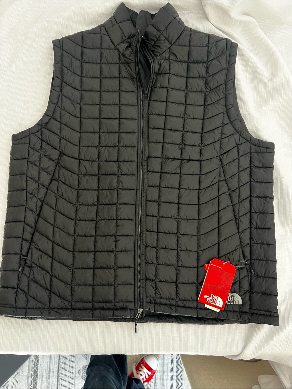 The North Face Black Quilted Packable Vest with Red Brand Tag